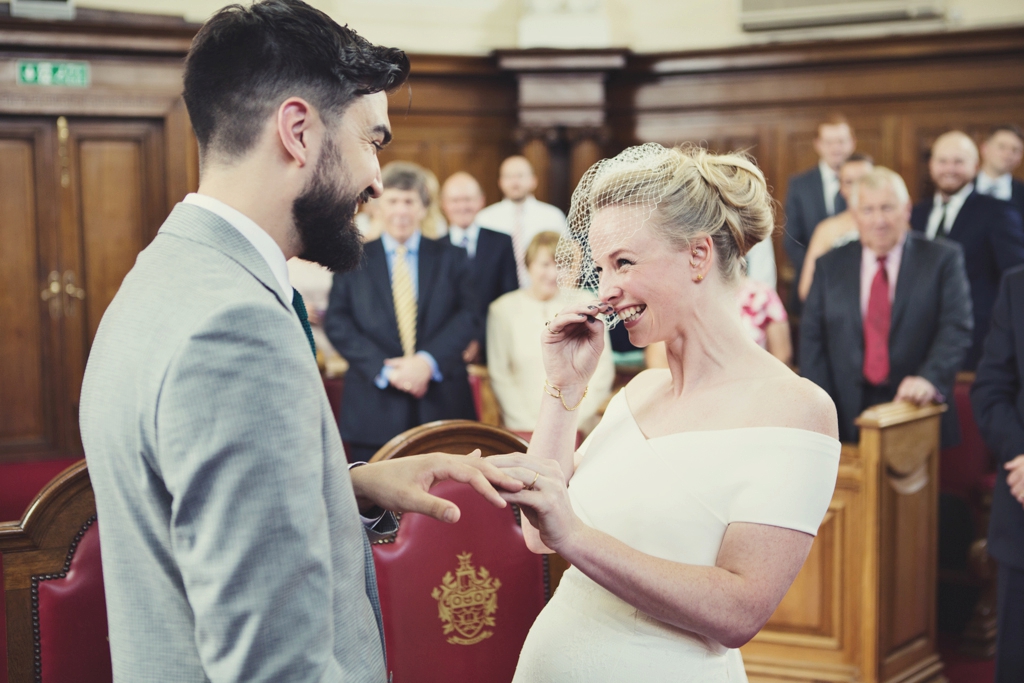 Bridal giggles during Islington Town Hall ceremony 