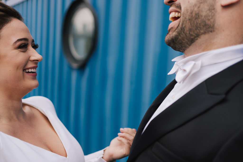 Bride and groom laughing at a Electrcians Shop Wedding by Lisa Jane Photography