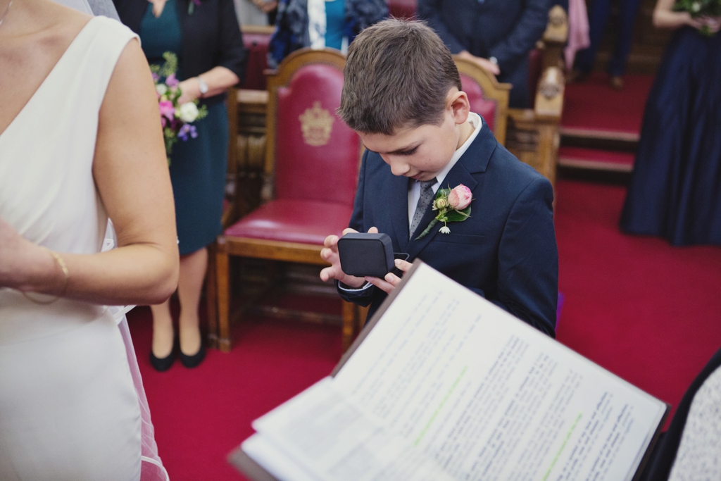 Little boy admires wedding rings Islington Town Hall London