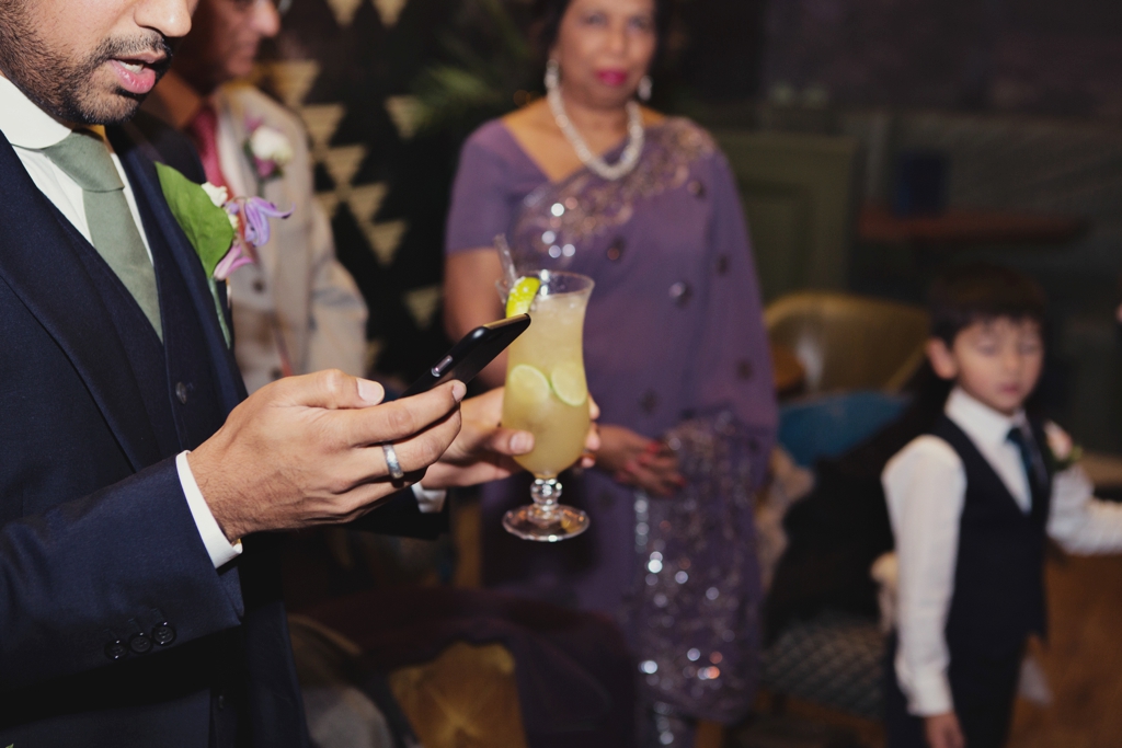 Groom with cocktail at Hoxley and Porter pub London