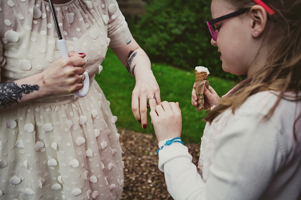 Little girl admires wedding ring Derby wedding photographer Lisa Jane Photography
