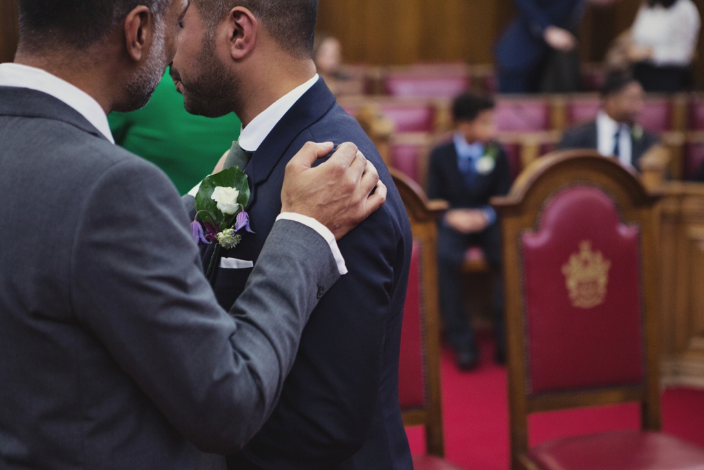 Groom awaits bride at Islington Town Hall London