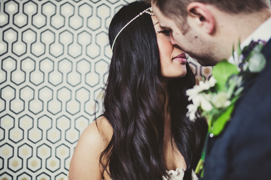 groom kissing his bride at The Roost in Hackney