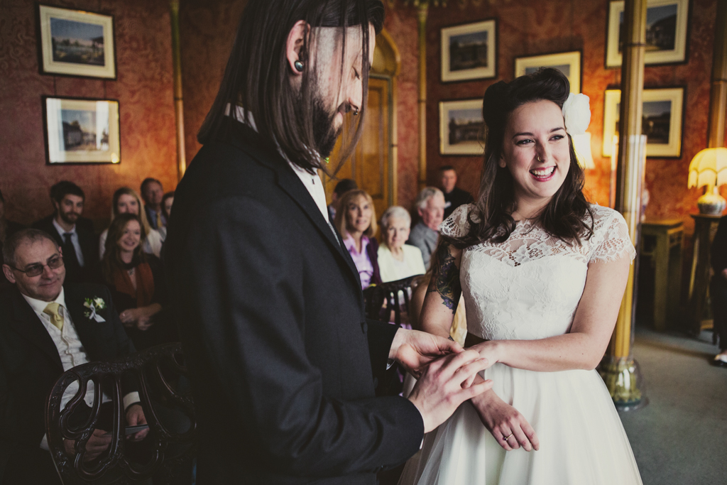 Fur Coat No Knickers bride smiling during wedding ring exchange Brighton