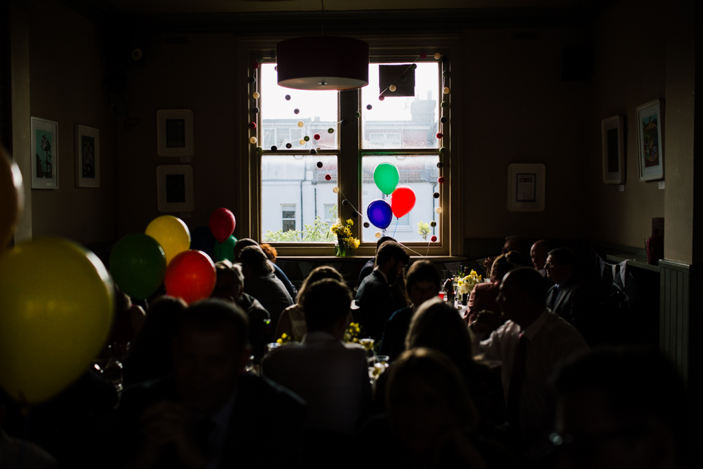 guests sitting at tables at a Brighton pub wedding