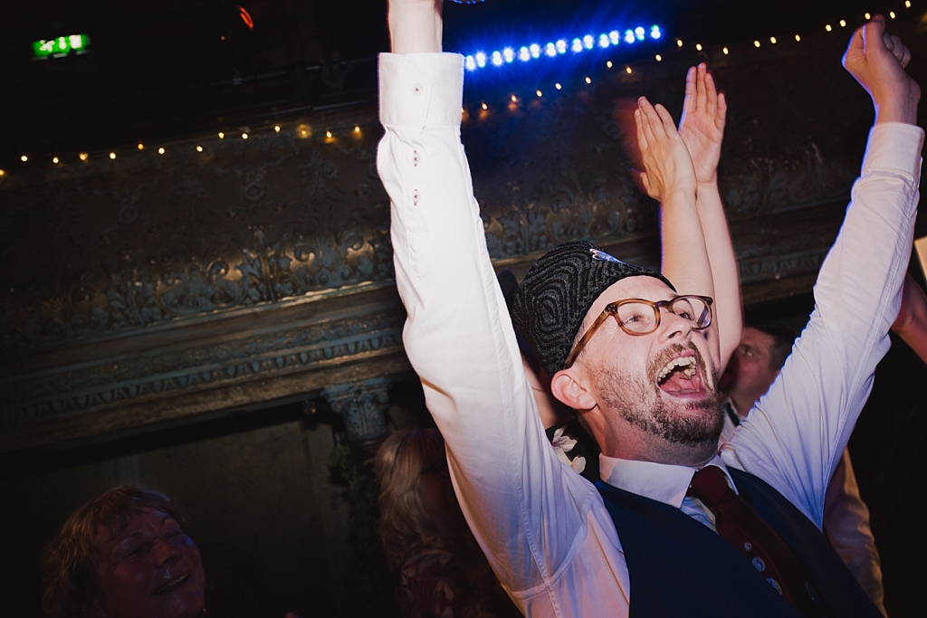 Groom in his custom made fez at a wiltons Music Hall Wedding