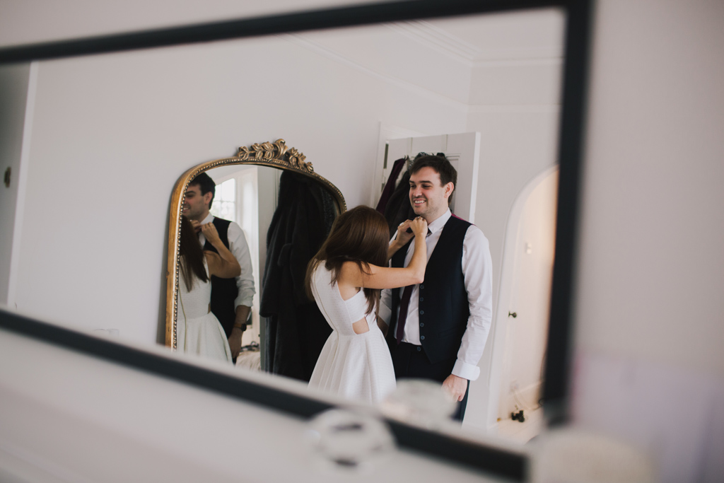 Couple getting ready together at a London Elopement | Lisa Jane Photography | London Elopement Wedding Photography