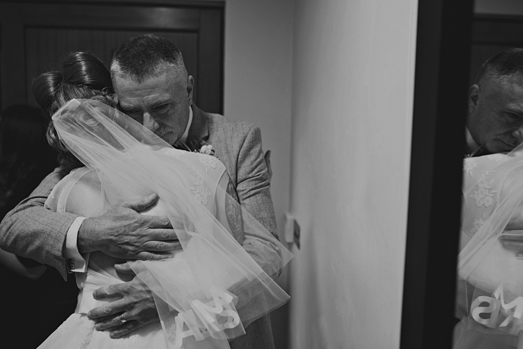 Bride hugging her dad at Northbrook Park Wedding | Lisa Jane Photography | Creative London Wedding Photography