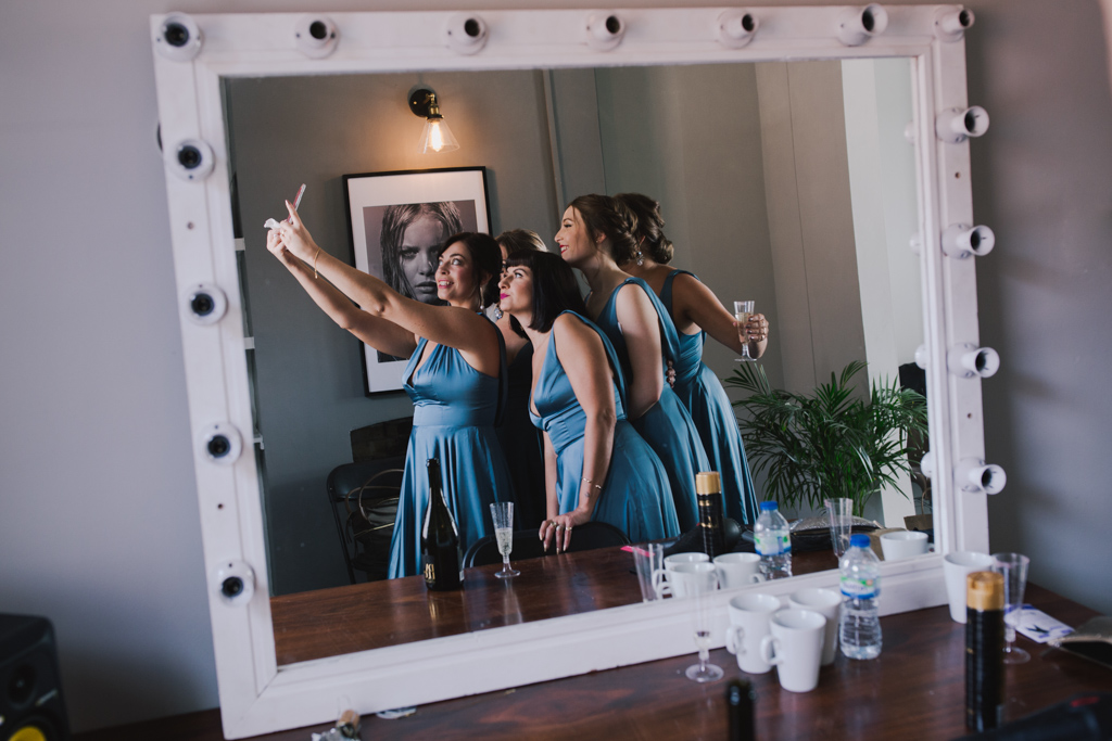 Bridesmaids taking a selfie at Loft Studio Wedding | Lisa Jane Photography | Creative London Wedding Photography