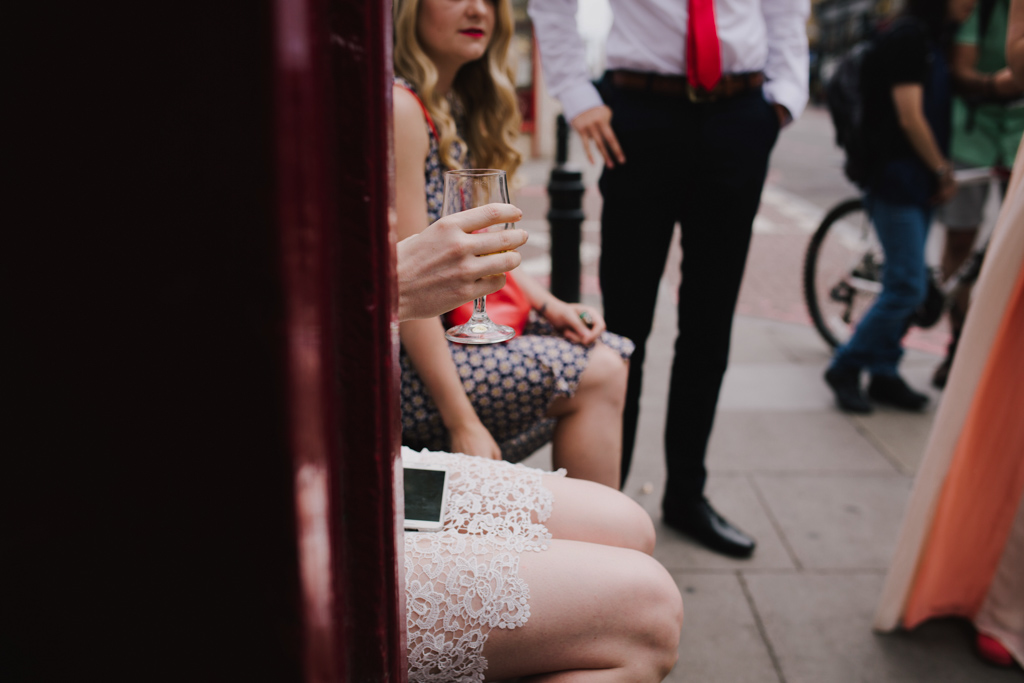 Bride having a drink before wedding ceremony | Lisa Jane Photography | Creative London Pub Wedding Photography