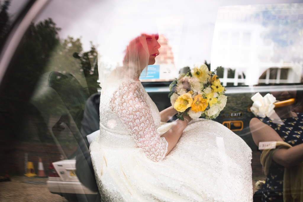 Bride in taxi at Brighton Town Hall Wedding | Lisa Jane Photography | Modern Brighton Wedding Photography
