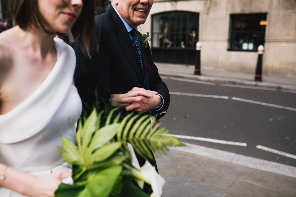 Bride walking to her Barbican Wedding with her dad | Lisa Jane Photography | Modern London Wedding Photography