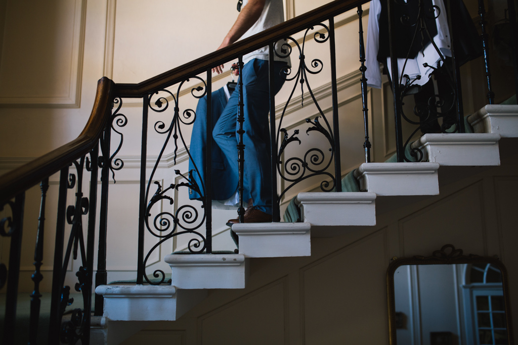 Groom walking down stairs | Lisa Jane Photography | Modern London Wedding Photography
