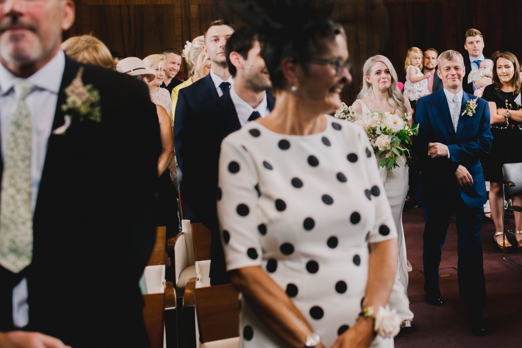 bride crying as she walks down the aisle at Stoke Newington Town Hall Wedding | Lisa Jane Photography | Modern London Wedding Photography