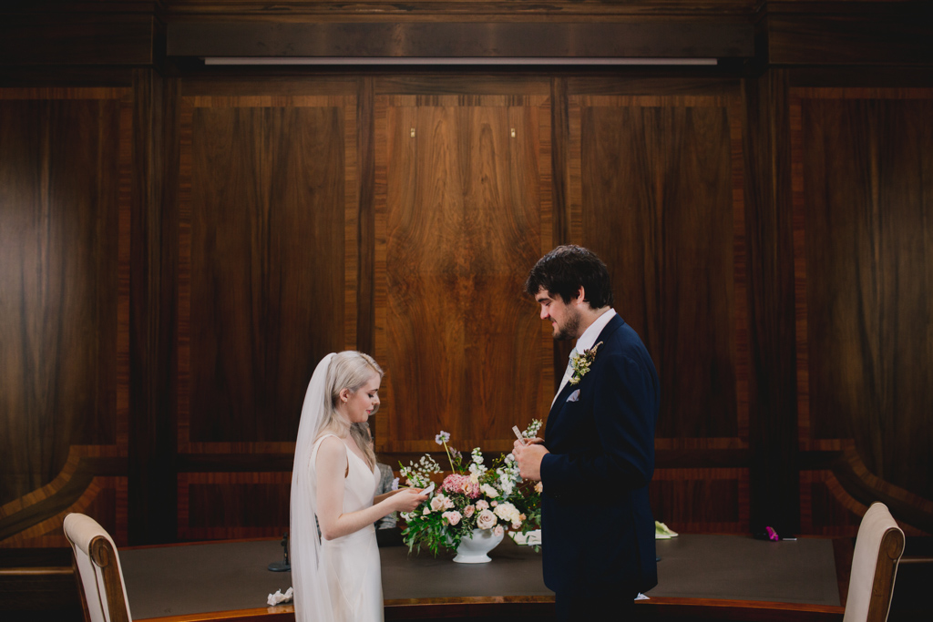 Bride and groom exchanging vows during a Stoke Newington Town Hall Wedding | Lisa Jane Photography | Modern London Wedding Photography