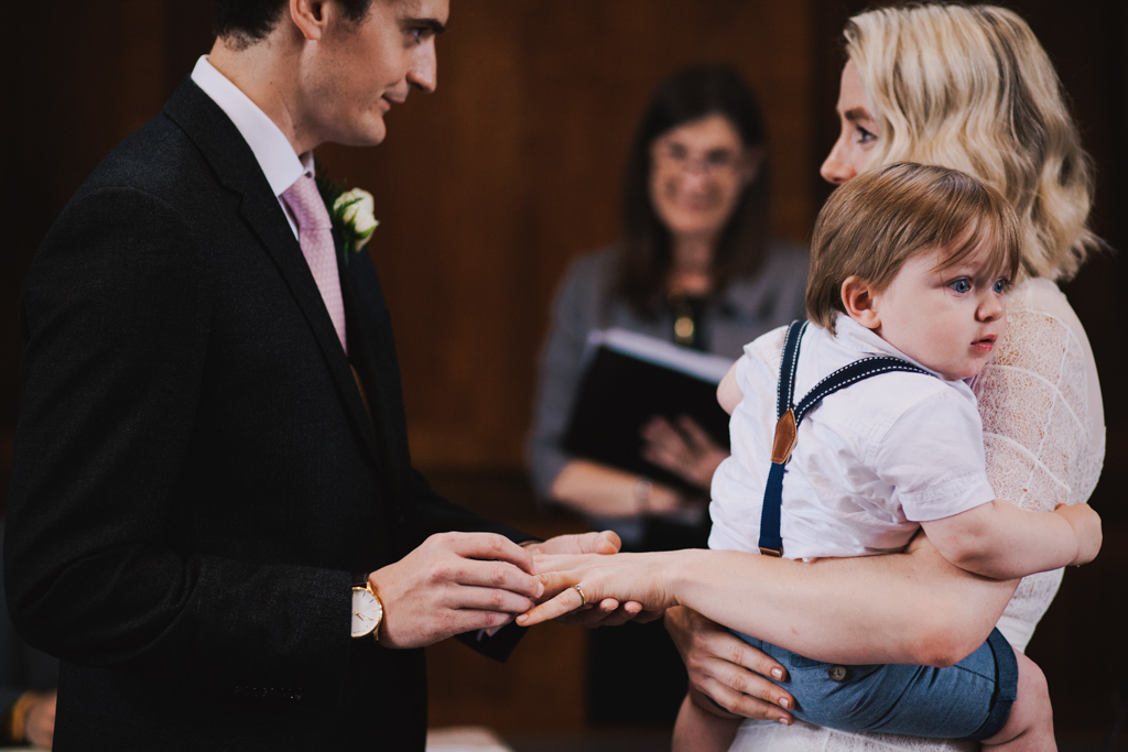 Bride and Groom exchanigng wedding vows at Stoke Newington Town Hall | Lisa Jane Photography | Modern London Wedding Photography