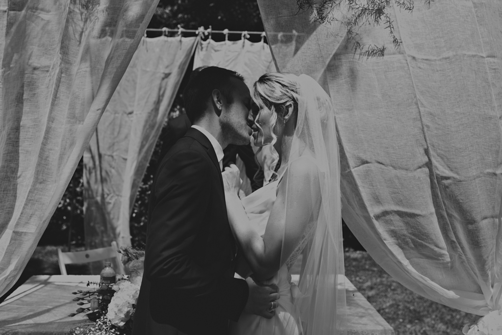 First kiss at an Italian outdoor wedding | Lisa Jane Photography | Modern Destination Wedding Photography