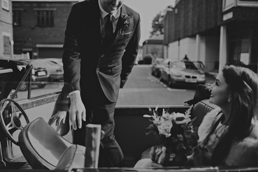 Groom getting into car after a couples London elopement | Lisa Jane Photography | Modern Elopement Wedding Photography