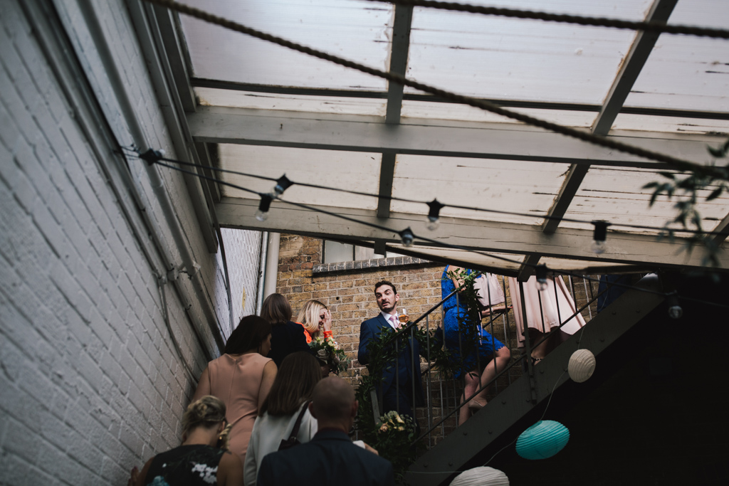 Guests entering wedding reception at Loft Studios London Wedding | Lisa Jane Photography | Modern London Wedding Photography