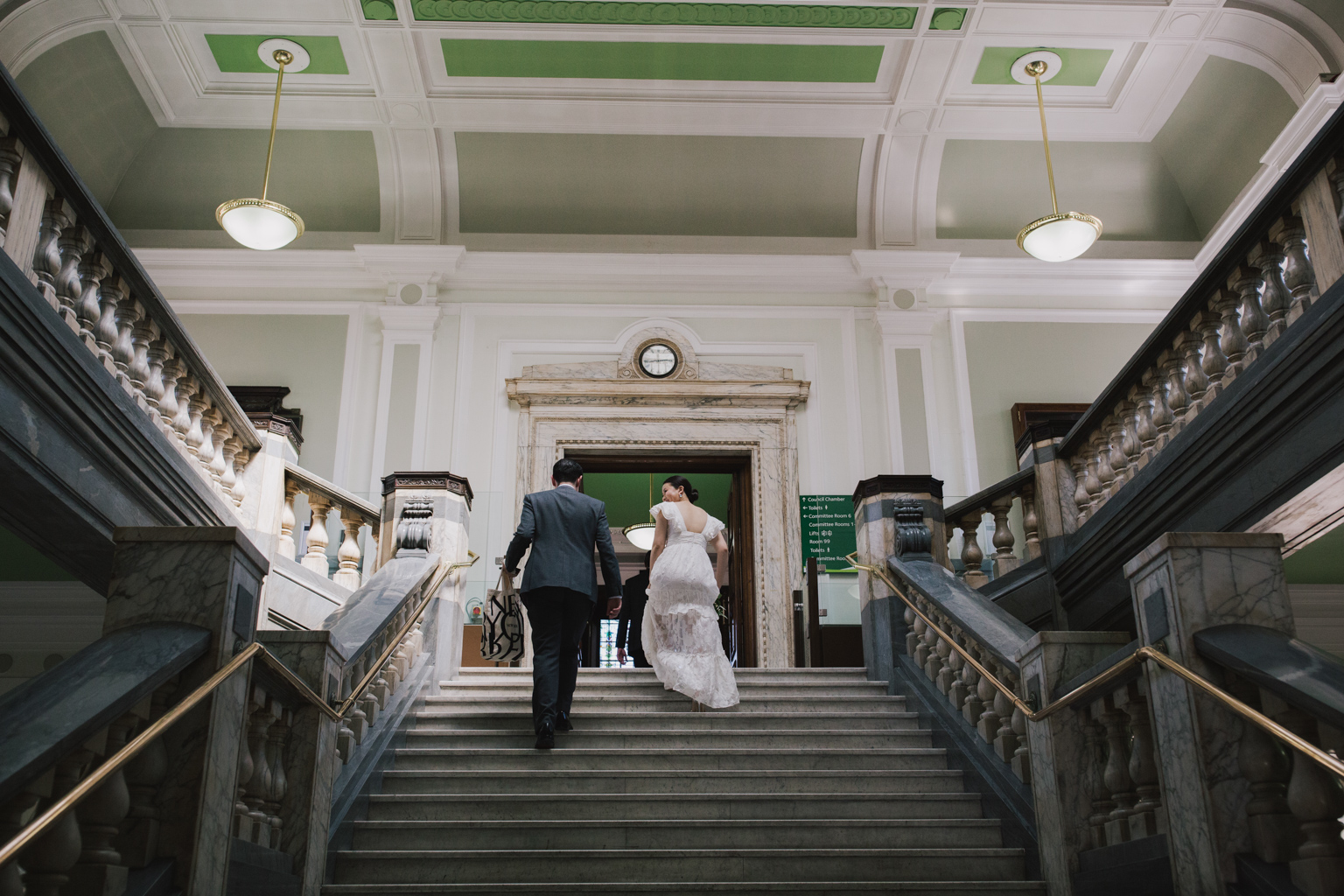 bride and groom walking to ceremony room at their Islington Town Hall Elopement