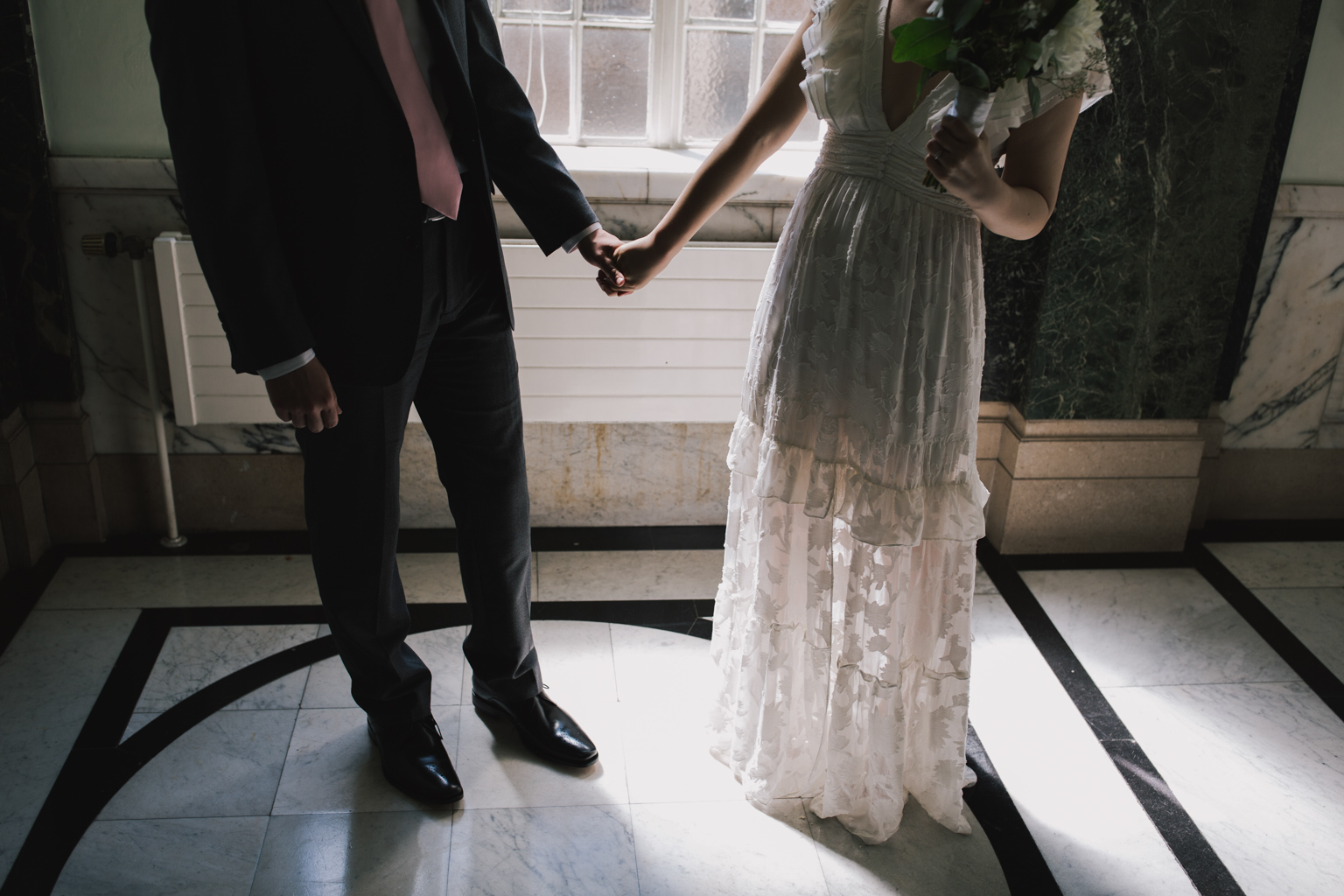 bride and groom holding hands during Islington Town Hall Elopement