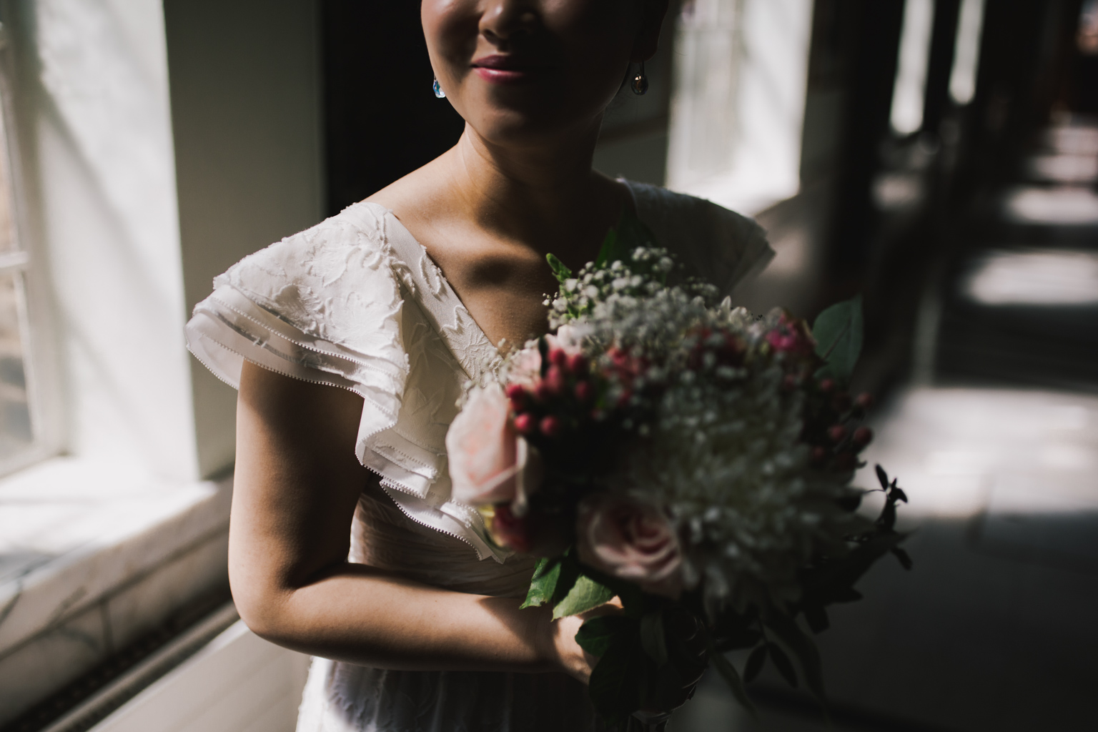 Bride with flowers in Islington Town Hall