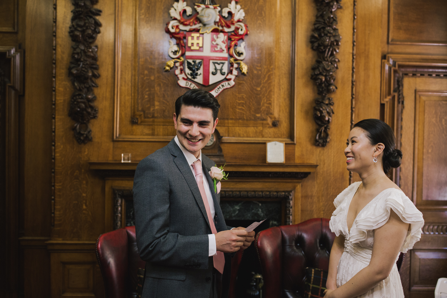Groom reading wedding vows during Islington Town Hall Elopement