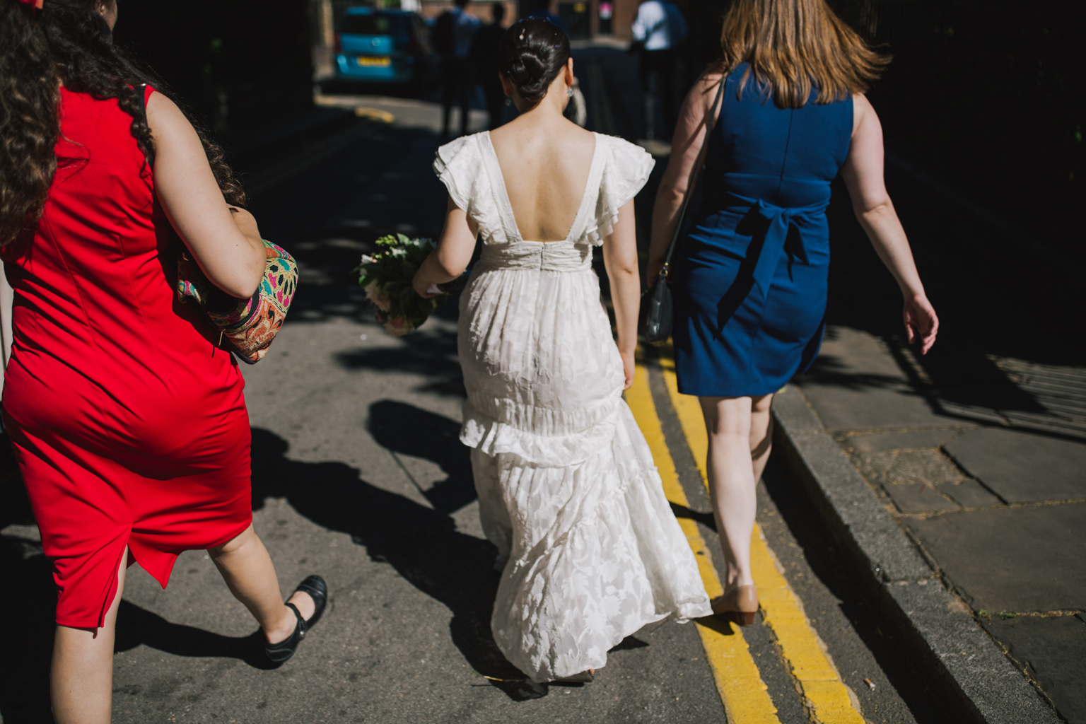 Bride walking through London streets at Islington Town Hall Wedding 
